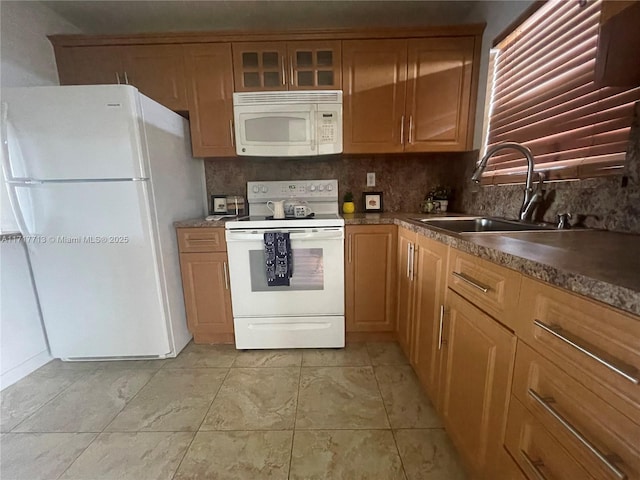 8345 Sunrise Lakes Blvd Unit 309, Sunrise, FL 33322 - kitchen with a sink, dark countertops, tasteful backsplash, and white appliances