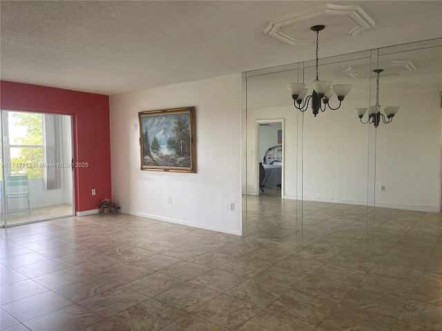 unfurnished room featuring an inviting chandelier