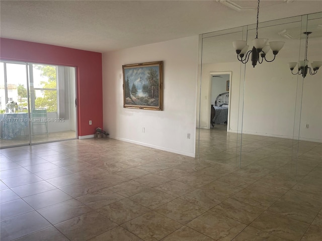 8345 Sunrise Lakes Blvd Unit 309, Sunrise, FL 33322 - unfurnished room with baseboards, a textured ceiling, and an inviting chandelier
