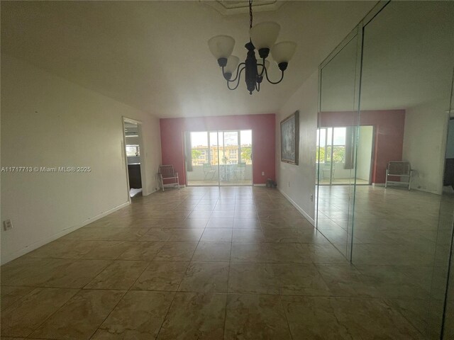 8345 Sunrise Lakes Blvd Unit 309, Sunrise, FL 33322 - empty room featuring baseboards and a chandelier