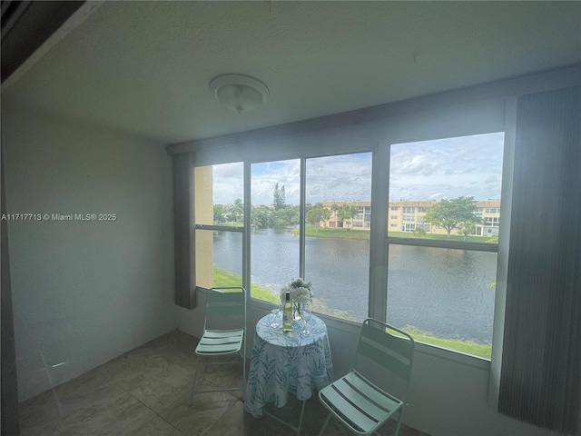 8345 Sunrise Lakes Blvd Unit 309, Sunrise, FL 33322 - sunroom / solarium with a water view and tile patterned flooring