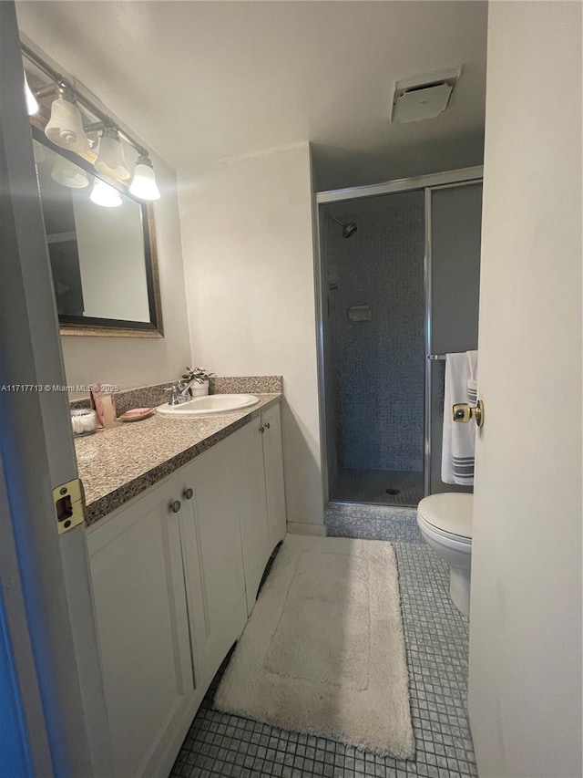 8345 Sunrise Lakes Blvd Unit 309, Sunrise, FL 33322 - bathroom with tile patterned flooring, vanity, toilet, a shower stall, and visible vents