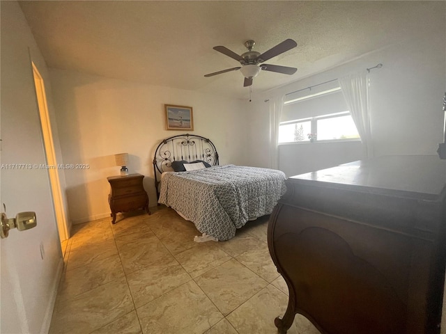 tiled bedroom with ceiling fan