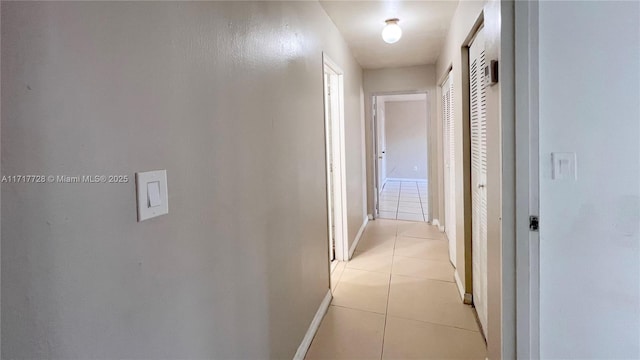 hallway with light tile patterned floors