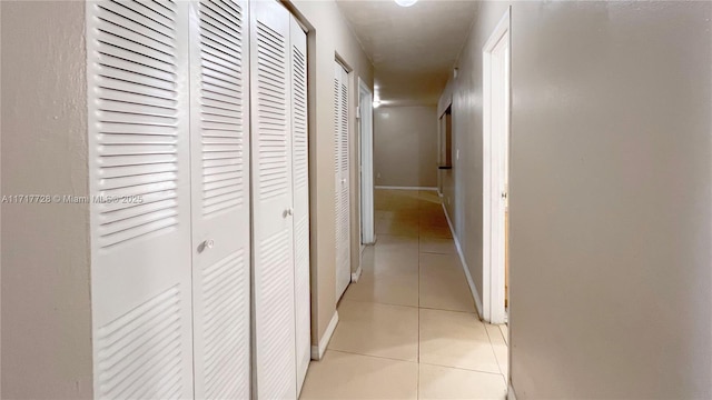 hallway featuring light tile patterned floors