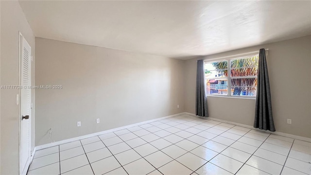 empty room with light tile patterned floors