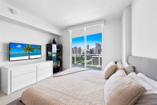 tiled bedroom with expansive windows