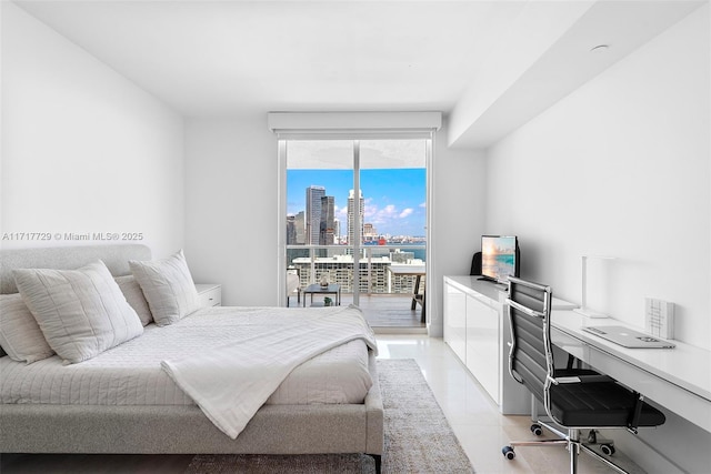 bedroom featuring access to outside and light tile patterned floors