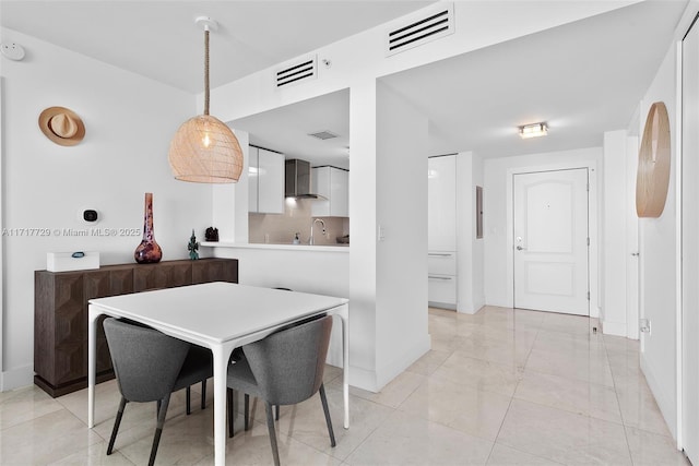 dining space featuring sink