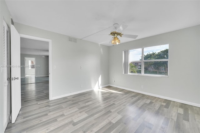 unfurnished room featuring ceiling fan and light hardwood / wood-style floors