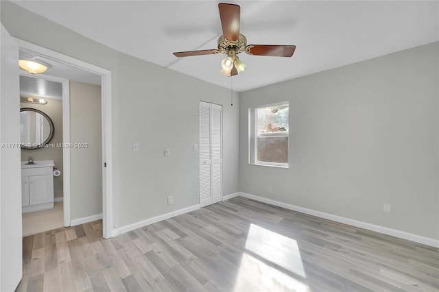 unfurnished bedroom with light wood-type flooring, a closet, and ceiling fan