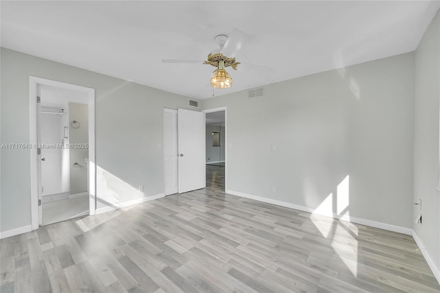 unfurnished bedroom with a closet, light hardwood / wood-style flooring, and ceiling fan