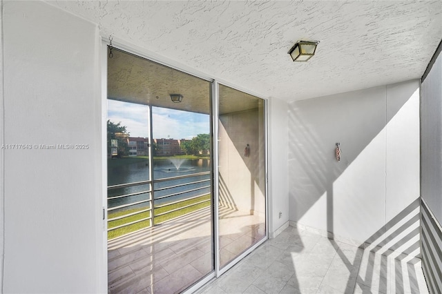 entrance to property featuring a water view