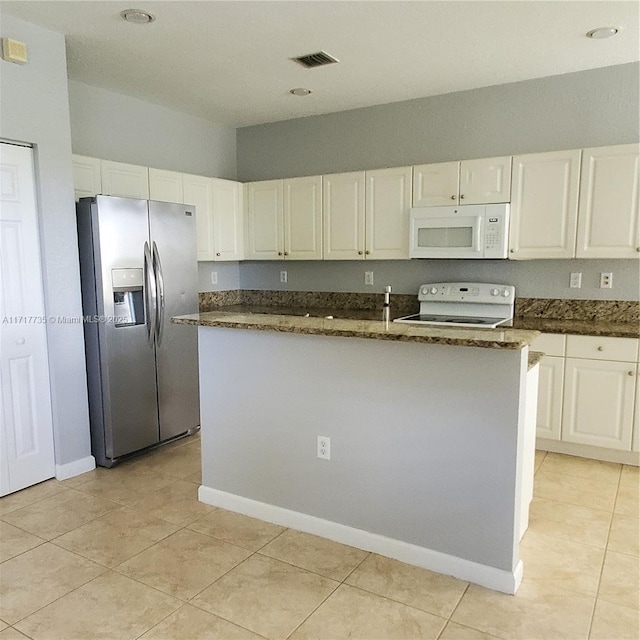 kitchen featuring a center island with sink, white cabinetry, range, and stainless steel refrigerator with ice dispenser