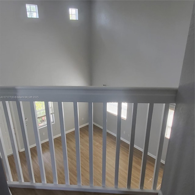 stairway with hardwood / wood-style flooring