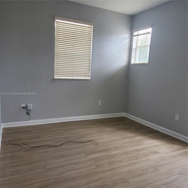 spare room with light wood-type flooring