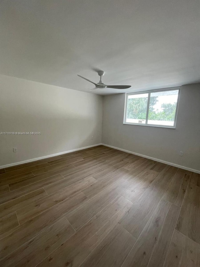 spare room with hardwood / wood-style floors