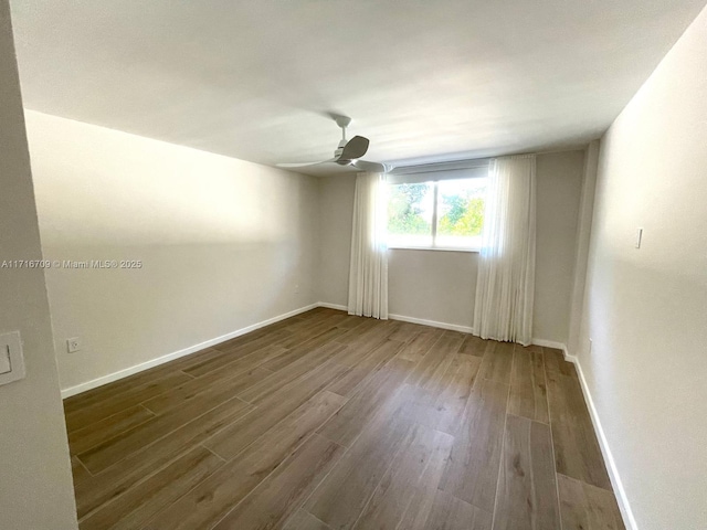 10230 Collins Ave Unit 102, Bal Harbour, FL 33154 - unfurnished room featuring dark wood-type flooring and ceiling fan