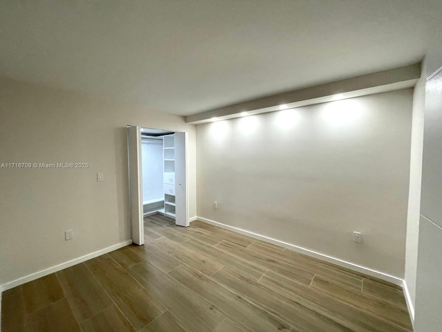 spare room with light wood-type flooring