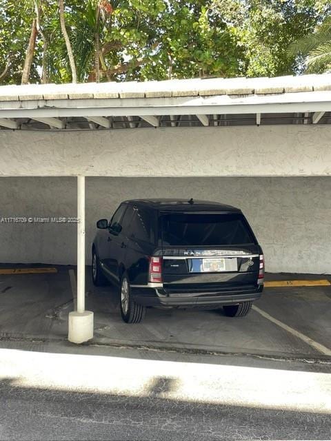 10230 Collins Ave Unit 102, Bal Harbour, FL 33154 - view of covered parking lot