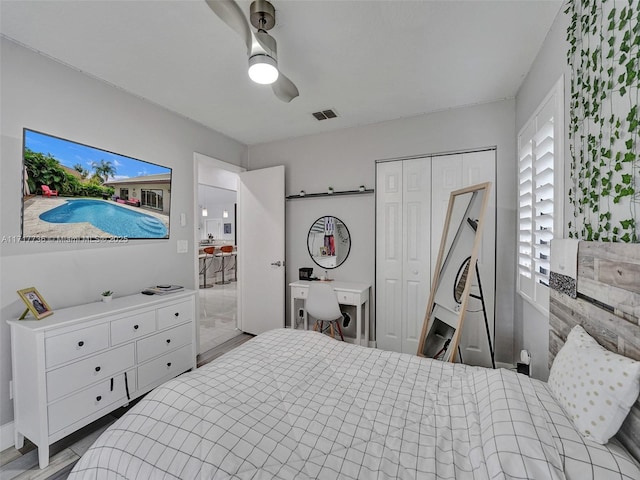 bedroom featuring ceiling fan and a closet