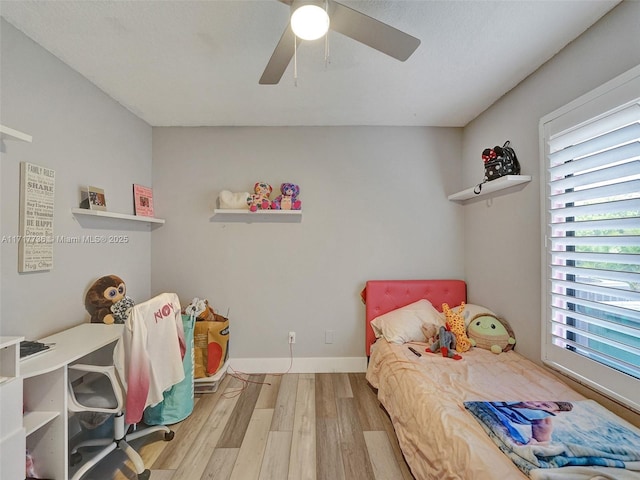 bedroom featuring light hardwood / wood-style floors and ceiling fan