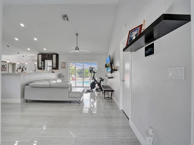 living room featuring ceiling fan and light tile patterned flooring