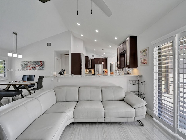 living room featuring vaulted ceiling