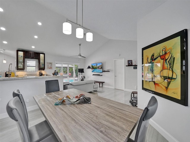 dining room with vaulted ceiling and ceiling fan