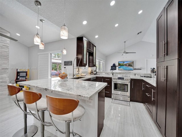 kitchen with kitchen peninsula, a textured ceiling, decorative light fixtures, stainless steel range with electric stovetop, and vaulted ceiling