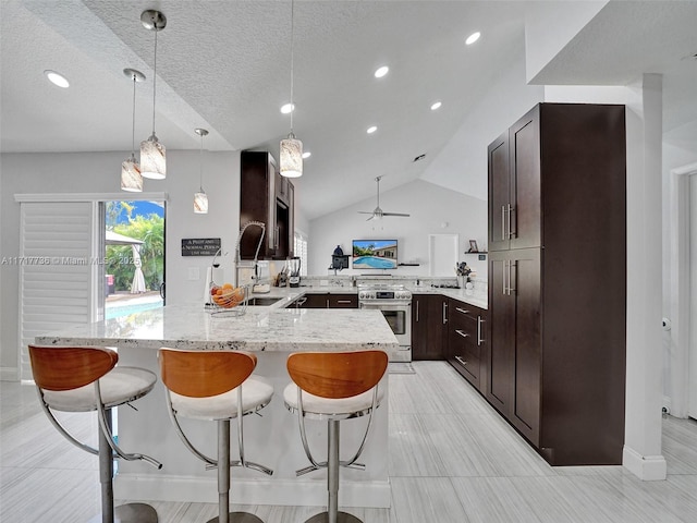 kitchen featuring lofted ceiling, hanging light fixtures, electric range, ceiling fan, and a textured ceiling