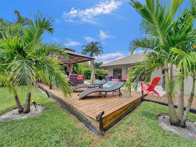 wooden deck featuring a gazebo, a yard, and an outdoor hangout area