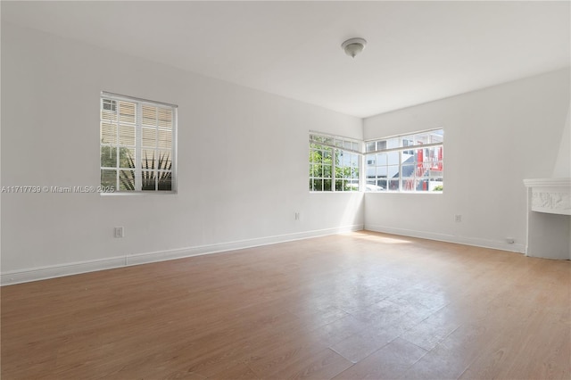 empty room with hardwood / wood-style flooring