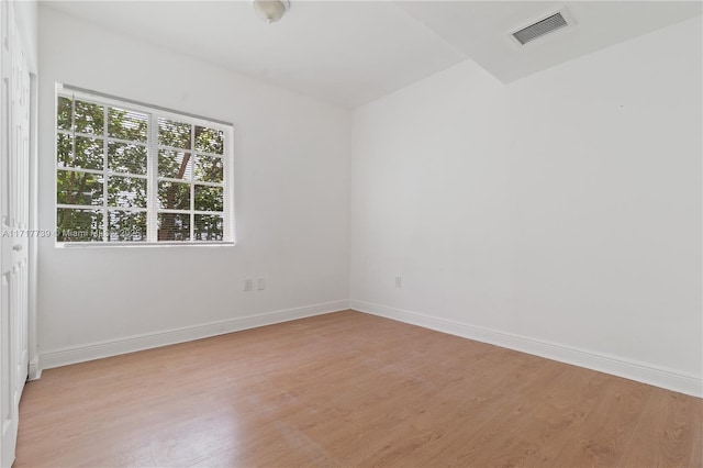 spare room featuring light hardwood / wood-style floors