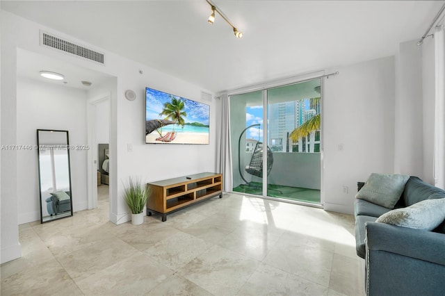 living room featuring a wall of windows