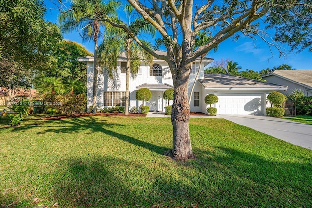 view of front of property featuring a front lawn and a garage