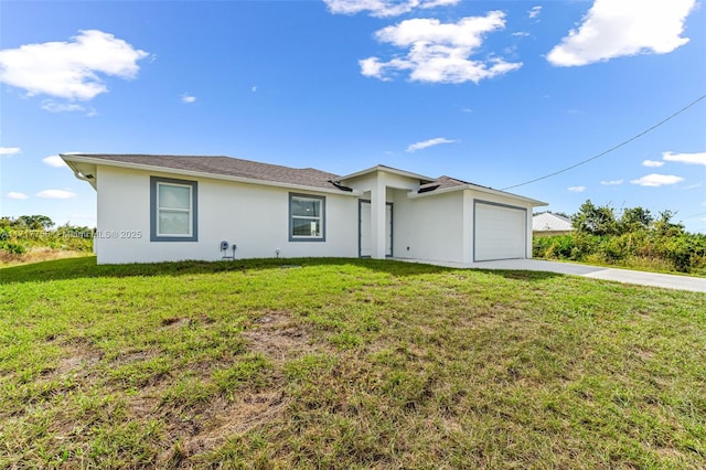 single story home featuring a garage and a front yard