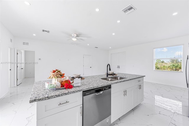 kitchen with an island with sink, white cabinetry, stainless steel dishwasher, and sink