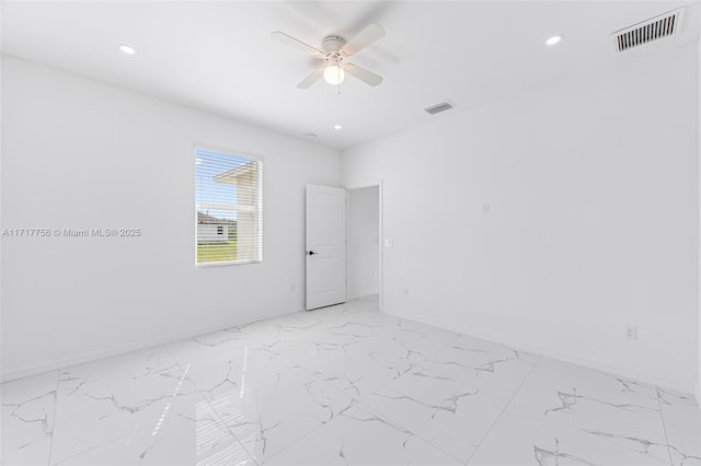 spare room with ceiling fan