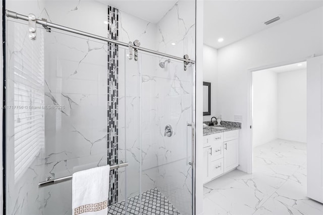 bathroom with vanity and an enclosed shower