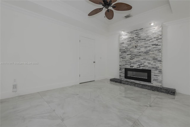 unfurnished living room featuring a tiled fireplace, ceiling fan, and ornamental molding