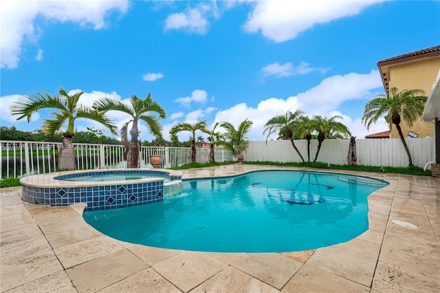 view of swimming pool featuring a patio area, an in ground hot tub, and a water view