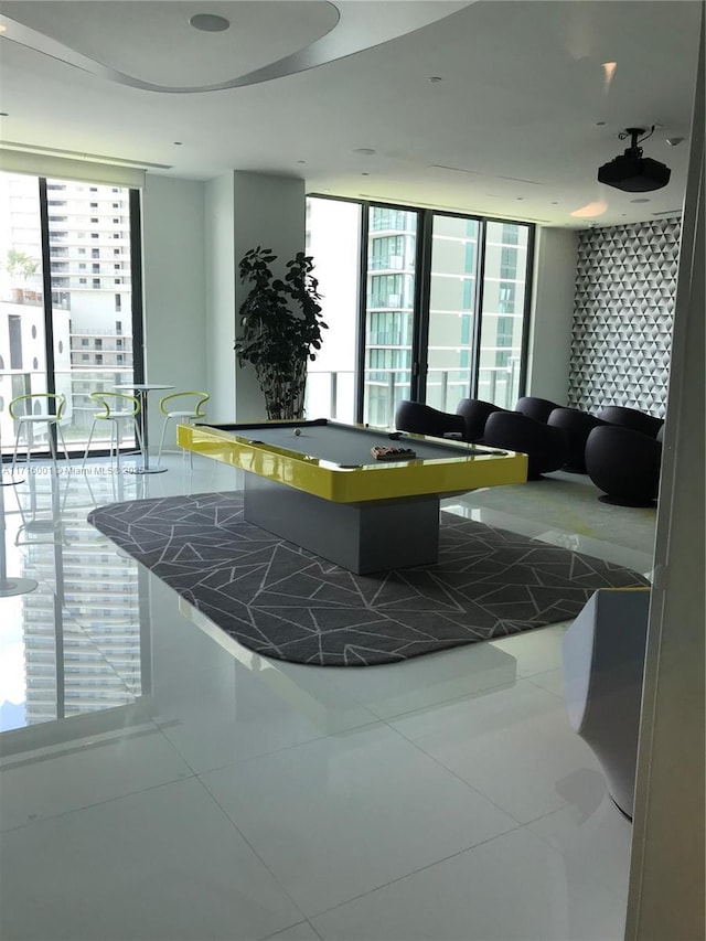 interior space featuring a wealth of natural light, tile patterned flooring, and pool table