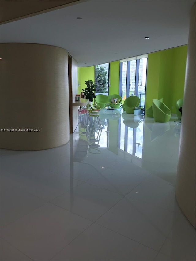 hallway with tile patterned floors