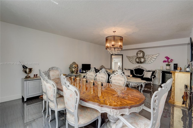 dining room featuring a textured ceiling and an inviting chandelier