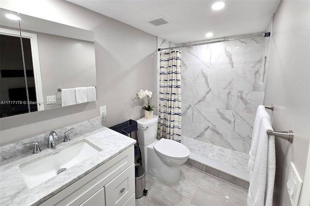 bathroom featuring toilet, vanity, and a shower with shower curtain