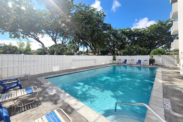 view of swimming pool featuring a patio