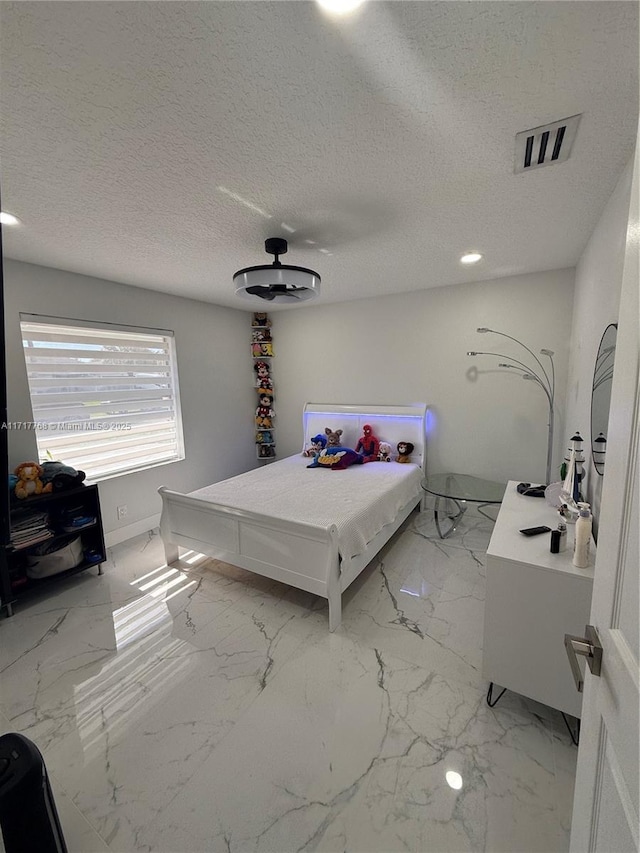 bedroom with a textured ceiling