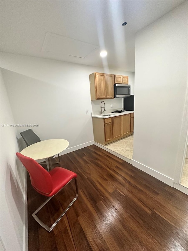 kitchen featuring sink and hardwood / wood-style flooring