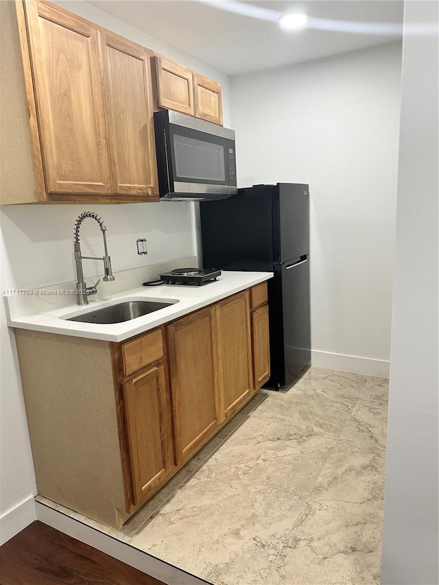 kitchen with sink and stainless steel appliances